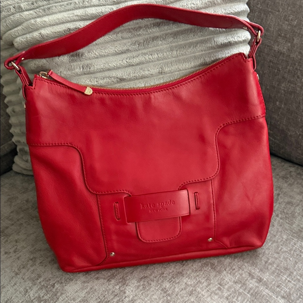 Kate Spade Vibrant Red with Floral lining.